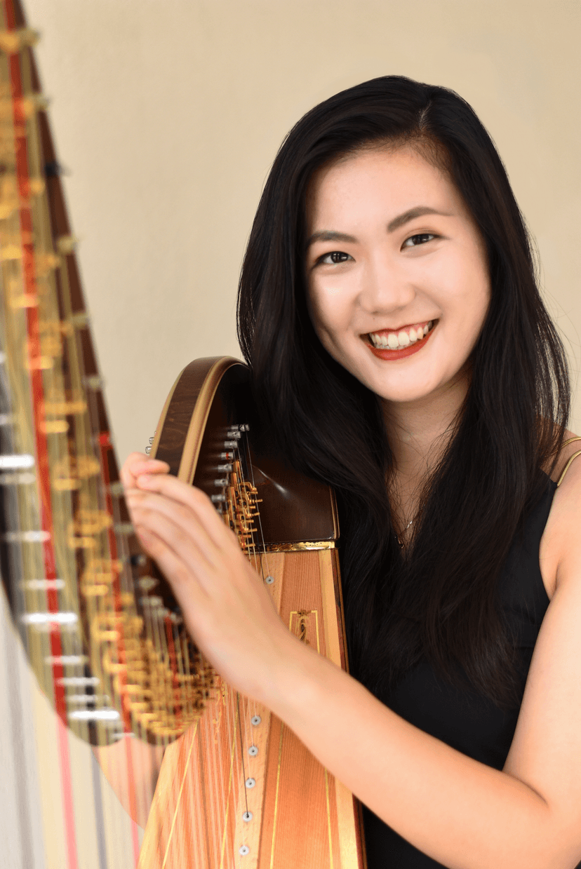 Lishan Tan smiling with Harp