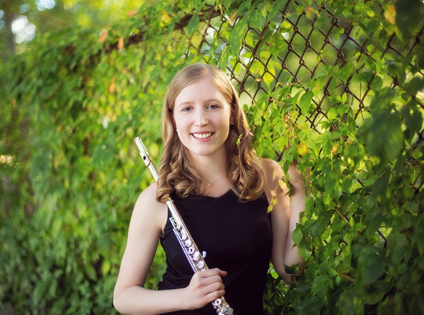 Angela Smiling in front of Greenery